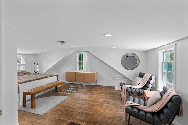 7537 Wentworth Ave, Richfield, MN 55423 - bedroom with wood finished floors, multiple windows, vaulted ceiling, and recessed lighting
