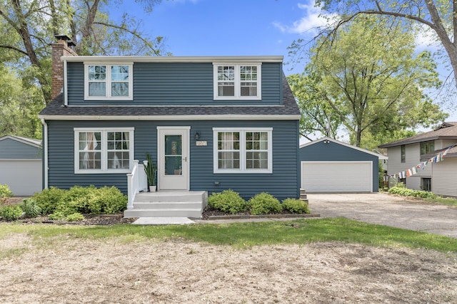 7537 Wentworth Ave, Richfield, MN 55423 - view of front of property featuring a garage, a shingled roof, an outdoor structure, and a chimney