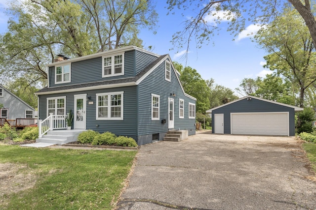 7537 Wentworth Ave, Richfield, MN 55423 - view of front of house featuring an outbuilding, a garage, a chimney, and roof with shingles
