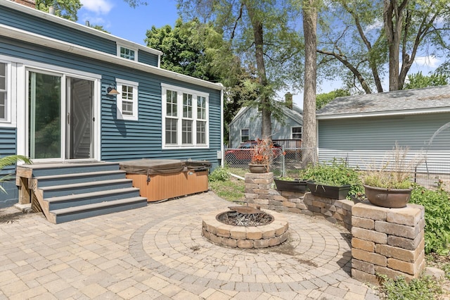 7537 Wentworth Ave, Richfield, MN 55423 - view of patio / terrace with a hot tub and a fire pit