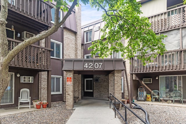 4207 Lakeside Ave N Unit 328, Brooklyn Center, MN 55429 - view of building exterior with a wall unit AC