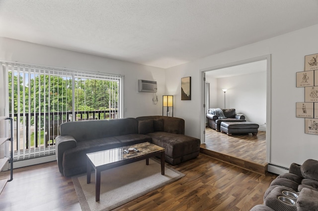 4207 Lakeside Ave N Unit 328, Brooklyn Center, MN 55429 - living room with a wall mounted air conditioner, dark wood-style flooring, baseboard heating, and a textured ceiling