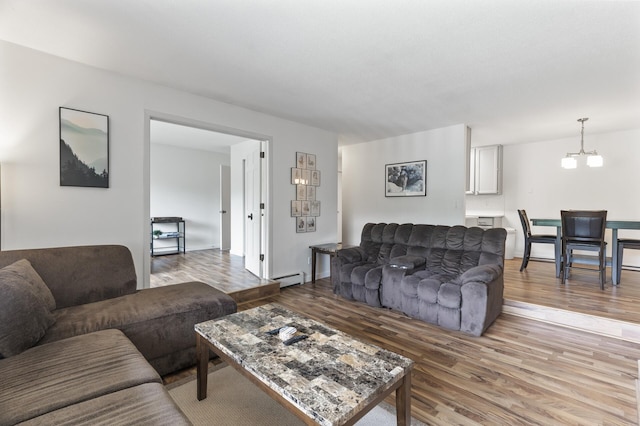 4207 Lakeside Ave N Unit 328, Brooklyn Center, MN 55429 - living area featuring a chandelier, light wood-style floors, and a baseboard heating unit