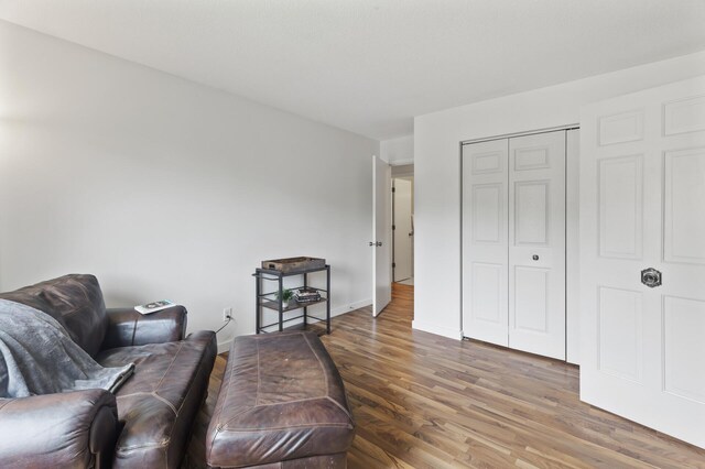 4207 Lakeside Ave N Unit 328, Brooklyn Center, MN 55429 - living area with wood finished floors and baseboards