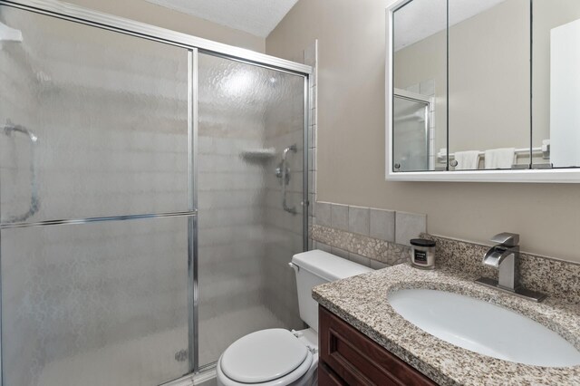 4207 Lakeside Ave N Unit 328, Brooklyn Center, MN 55429 - bathroom with toilet, vanity, and a shower stall