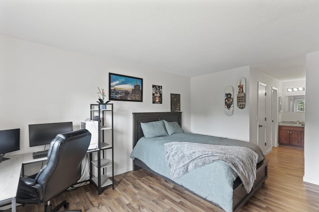 4207 Lakeside Ave N Unit 328, Brooklyn Center, MN 55429 - bedroom featuring wood finished floors and a desk