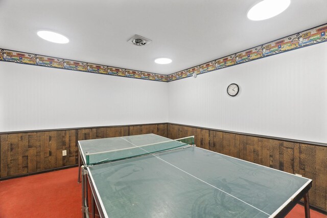 4207 Lakeside Ave N Unit 328, Brooklyn Center, MN 55429 - rec room with wainscoting, carpet flooring, and wooden walls