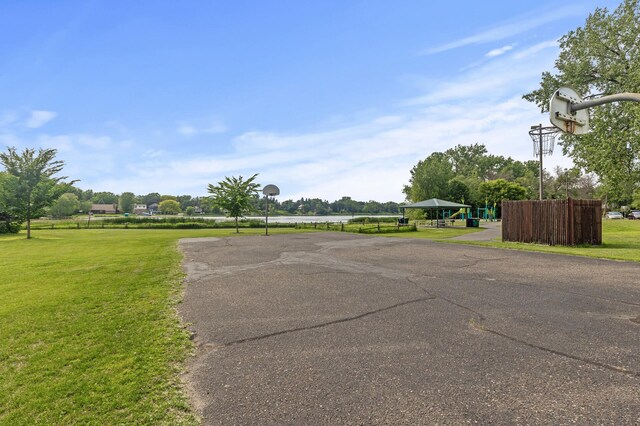 4207 Lakeside Ave N Unit 328, Brooklyn Center, MN 55429 - view of asphalt road with a water view and street lighting