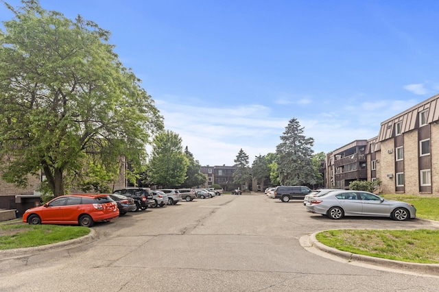 4207 Lakeside Ave N Unit 328, Brooklyn Center, MN 55429 - view of asphalt road featuring curbs
