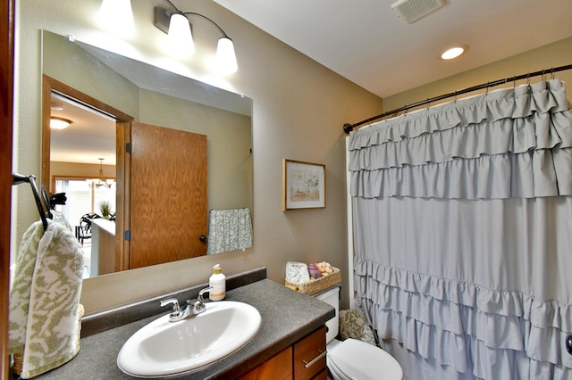 1756 34th St NE, Sauk Rapids, MN 56379 - bathroom featuring vanity and toilet