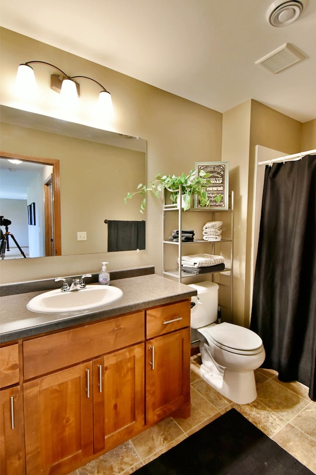 1756 34th St NE, Sauk Rapids, MN 56379 - full bath featuring vanity, toilet, tile patterned floors, and a shower with shower curtain