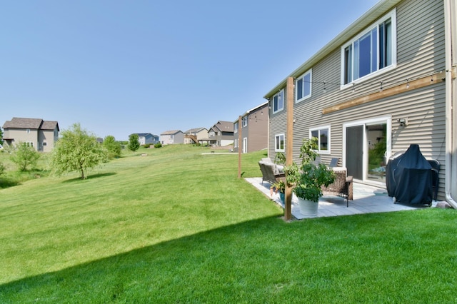1756 34th St NE, Sauk Rapids, MN 56379 - view of grassy yard with a patio and a residential view