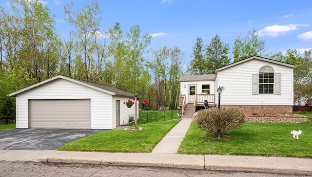 29 Burger Dr, Duluth, MN 55808 - view of front of property with a detached garage, an outdoor structure, stairs, and a wooden deck