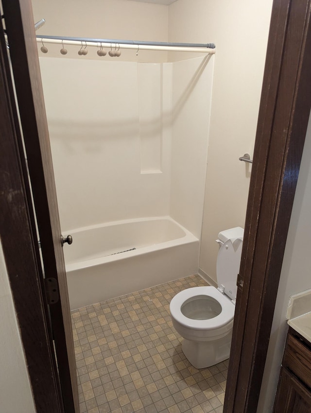 10451 Greenbrier Rd Unit 115, Minnetonka, MN 55305 - bathroom with toilet,  shower combination, tile patterned floors, and vanity