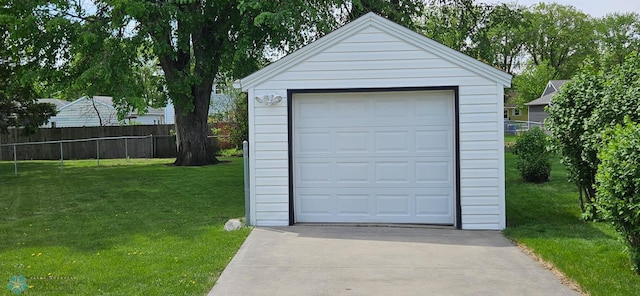 911 16th St N, Moorhead, MN 56560 - detached garage featuring concrete driveway