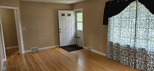 911 16th St N, Moorhead, MN 56560 - entryway with wood finished floors and baseboards