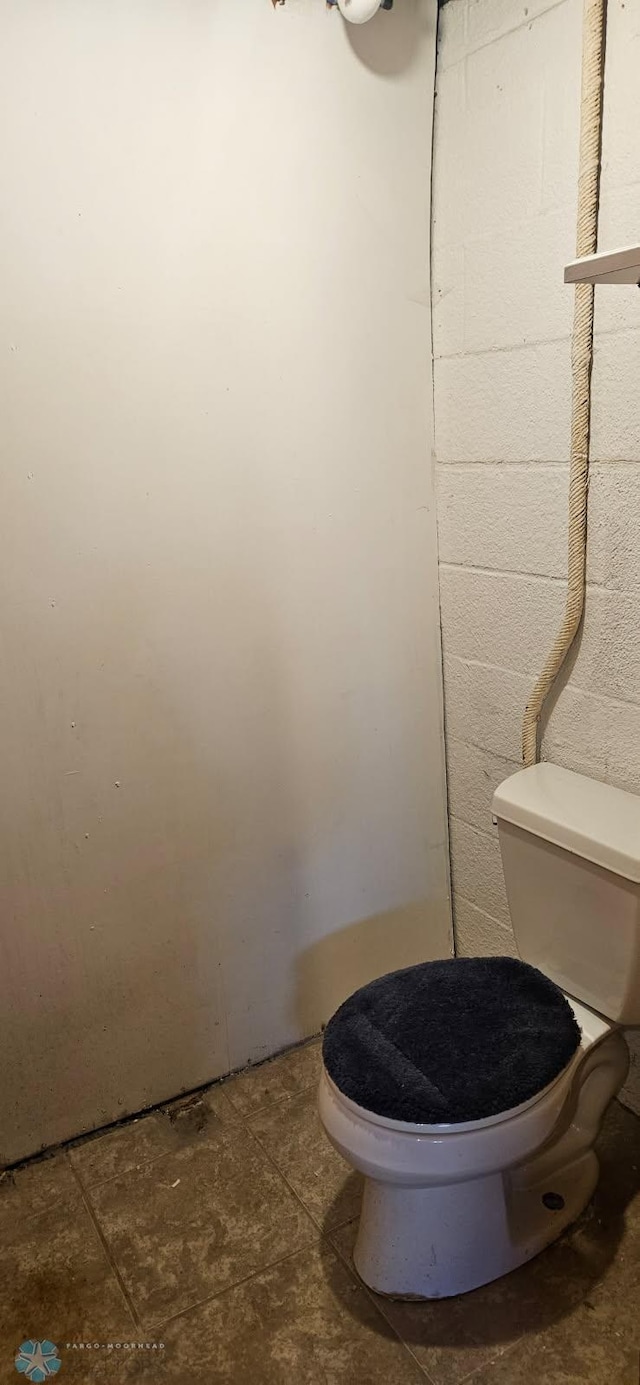 911 16th St N, Moorhead, MN 56560 - bathroom featuring toilet and concrete block wall