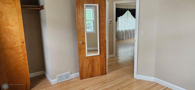 911 16th St N, Moorhead, MN 56560 - hallway with baseboards and wood finished floors