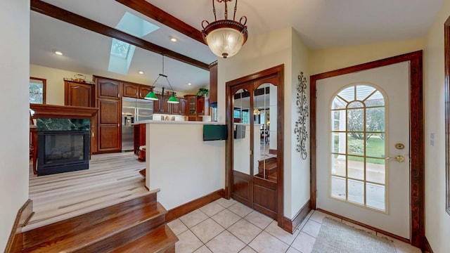 402 Main St, Racine, MN 55967 - entryway featuring a skylight, plenty of natural light, baseboards, a premium fireplace, and recessed lighting