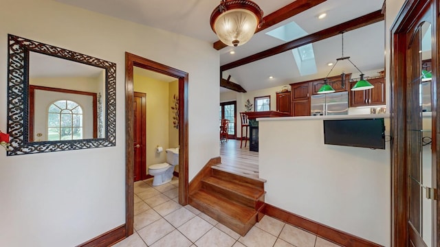 402 Main St, Racine, MN 55967 - kitchen with stainless steel refrigerator with ice dispenser, a skylight, baseboards, light tile patterned floors, and recessed lighting
