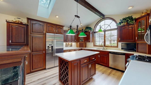 402 Main St, Racine, MN 55967 - kitchen with stainless steel appliances, a sink, light wood-style flooring, and a skylight