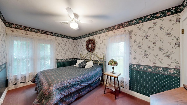 402 Main St, Racine, MN 55967 - carpeted bedroom with wallpapered walls and a ceiling fan