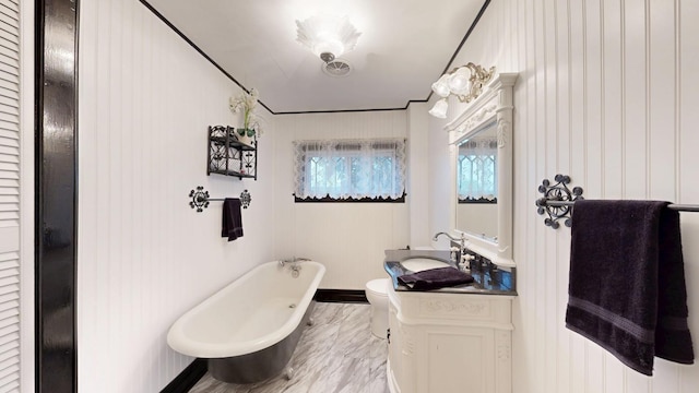 402 Main St, Racine, MN 55967 - bathroom featuring a freestanding bath, vanity, and toilet