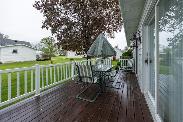 402 Main St, Racine, MN 55967 - deck featuring outdoor dining space and a yard