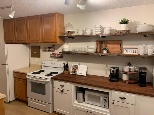 2800 Hillsboro Ave N Unit 316, New Hope, MN 55427 - kitchen featuring white appliances, open shelves, butcher block countertops, a textured ceiling, and light wood-style floors