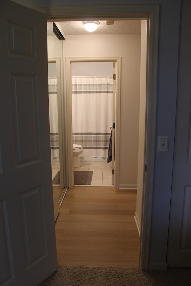 2800 Hillsboro Ave N Unit 316, New Hope, MN 55427 - hall featuring wood finished floors and baseboards