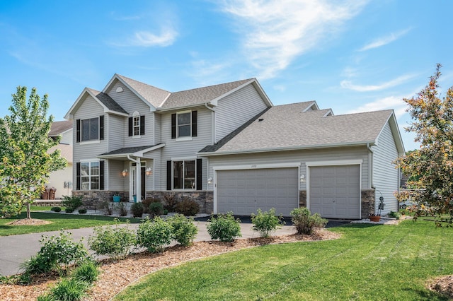 1498 Fox Meadow Dr, Delano, MN 55328 - view of front of home featuring an attached garage, a front lawn, stone siding, and roof with shingles