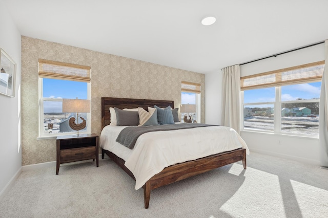 7572 Norway Ln, Lino Lakes, MN 55038 - bedroom featuring baseboards, wallpapered walls, and light carpet