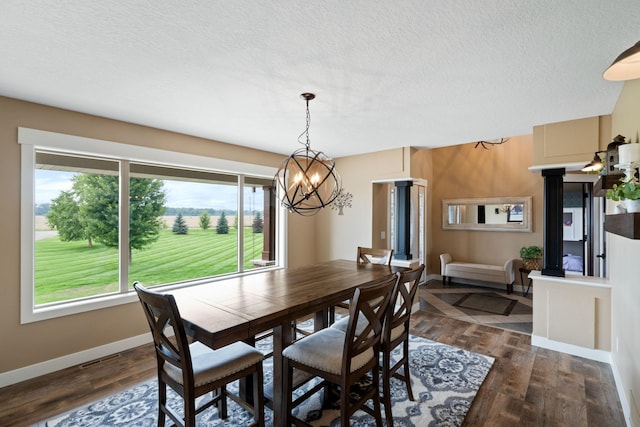6339 140th Ave SE, Clear Lake, MN 55319 - dining area with a chandelier, dark wood finished floors, and a textured ceiling