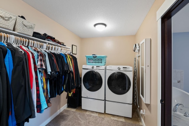 6339 140th Ave SE, Clear Lake, MN 55319 - laundry area with washer and clothes dryer, a textured ceiling, and tile patterned flooring