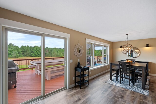 6339 140th Ave SE, Clear Lake, MN 55319 - dining room with a chandelier and wood finished floors