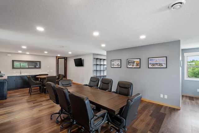 6339 140th Ave SE, Clear Lake, MN 55319 - office featuring dark wood-style flooring, recessed lighting, bar with sink, and a textured ceiling