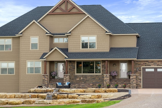 6339 140th Ave SE, Clear Lake, MN 55319 - view of front facade with a shingled roof, stone siding, and driveway