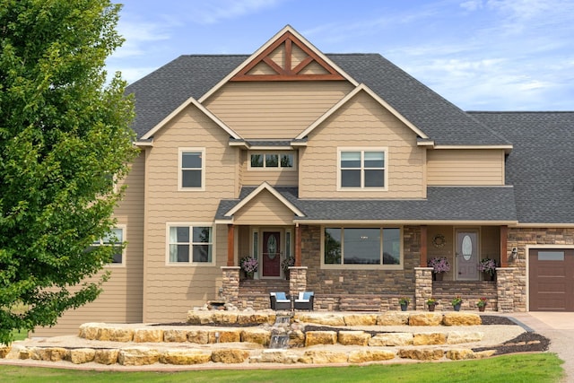 6339 140th Ave SE, Clear Lake, MN 55319 - craftsman house featuring a shingled roof, stone siding, and an attached garage