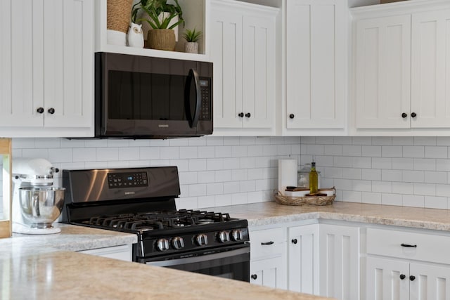 6339 140th Ave SE, Clear Lake, MN 55319 - kitchen with gas range, white cabinets, and decorative backsplash