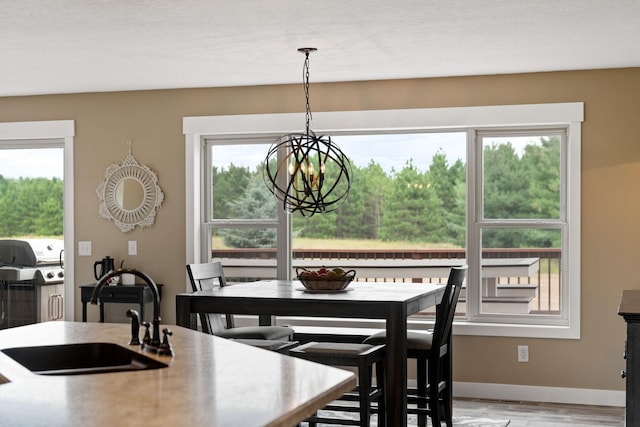 6339 140th Ave SE, Clear Lake, MN 55319 - dining room featuring a chandelier and light wood-style floors