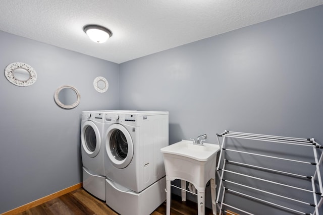 6339 140th Ave SE, Clear Lake, MN 55319 - laundry room featuring washer and clothes dryer, dark wood-style flooring, and a textured ceiling