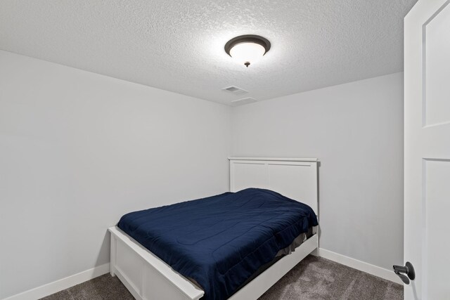 6339 140th Ave SE, Clear Lake, MN 55319 - carpeted bedroom with a textured ceiling and baseboards