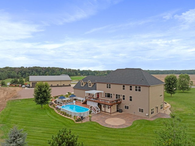 6339 140th Ave SE, Clear Lake, MN 55319 - back of property with a patio, a deck, and a lawn