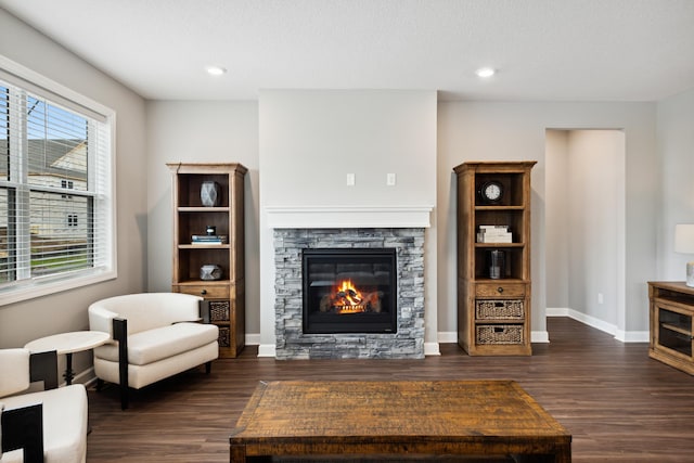 7665 Swan St, Lino Lakes, MN 55038 - living room featuring a fireplace, dark wood finished floors, baseboards, and recessed lighting