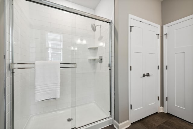 7665 Swan St, Lino Lakes, MN 55038 - full bathroom featuring a shower stall and baseboards