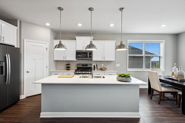 7665 Swan St, Lino Lakes, MN 55038 - kitchen with appliances with stainless steel finishes, dark wood-style flooring, light countertops, and recessed lighting