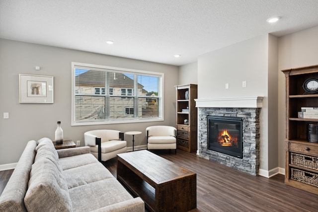 7665 Swan St, Lino Lakes, MN 55038 - living area with dark wood finished floors, a stone fireplace, and recessed lighting