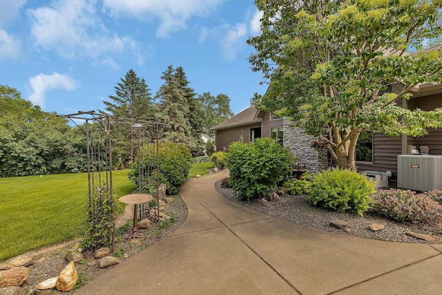 72959 235th St, Dassel, MN 55325 - view of home's exterior featuring a lawn and stone siding