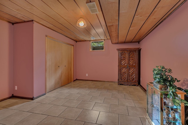 72959 235th St, Dassel, MN 55325 - unfurnished bedroom with wood ceiling, a closet, and light tile patterned floors
