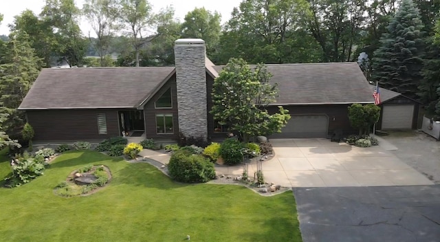 72959 235th St, Dassel, MN 55325 - view of front facade with a chimney, concrete driveway, a front lawn, and roof with shingles